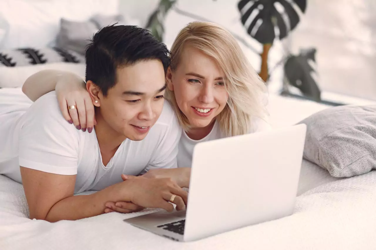 couple checking computer screen